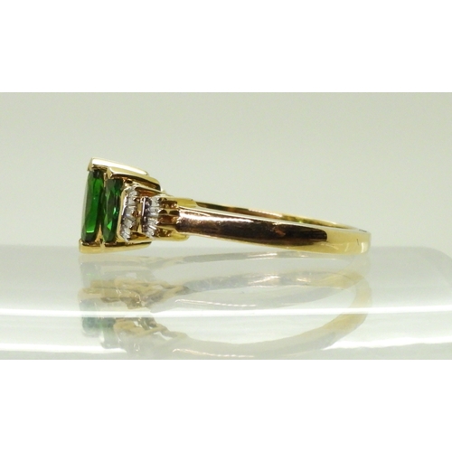 2759 - A RUSSIAN DIOPSIDE AND DIAMOND RINGset with three marquis cut Russian diopsides, with baguette cut d... 