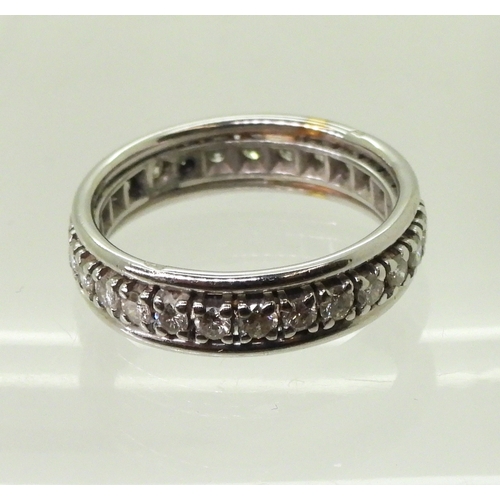 2761 - A DIAMOND FULL ETERNITY RINGstamped with the French eagle's head hallmark for 18ct white gold. Set w... 