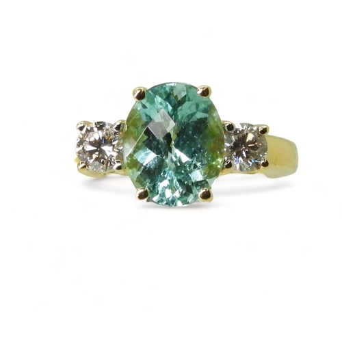 2762 - AN APATITE AND DIAMOND RINGset with a checkerboard cut apatite of 9.7mm x 7.9mm, in the classic... 