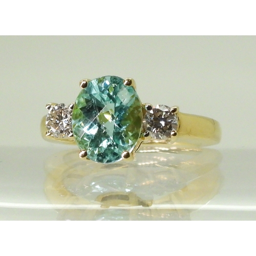 2762 - AN APATITE AND DIAMOND RINGset with a checkerboard cut apatite of 9.7mm x 7.9mm, in the classic... 