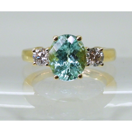 2762 - AN APATITE AND DIAMOND RINGset with a checkerboard cut apatite of 9.7mm x 7.9mm, in the classic... 