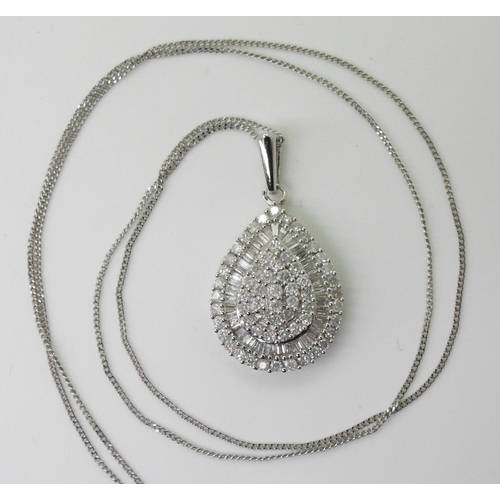 2764 - A DIAMOND PENDANTthe 9ct white gold pear shaped pendant is set with pave and channel set brilliant a... 