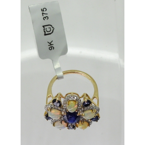 2767 - A FLOWER STATEMENT RINGset with sapphires, Ethiopian opals and white zircons, mounted in 9ct gold. D... 