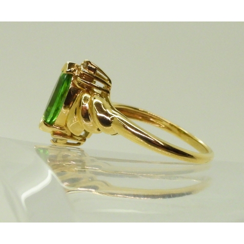 2768 - A TSAVORITE & DIAMOND RINGmounted in 18ct gold, made by GemsTV, set with a marquis cut tsavorite... 