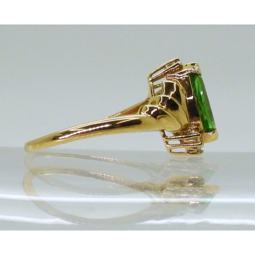 2768 - A TSAVORITE & DIAMOND RINGmounted in 18ct gold, made by GemsTV, set with a marquis cut tsavorite... 