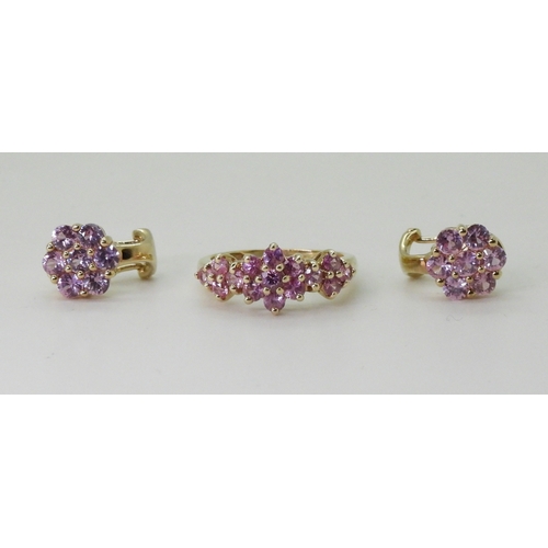 2769 - PINK SAPPHIRE FLOWER SUITEcomprising of a 9ct gold ring, finger size K, with a pair of similar earri... 