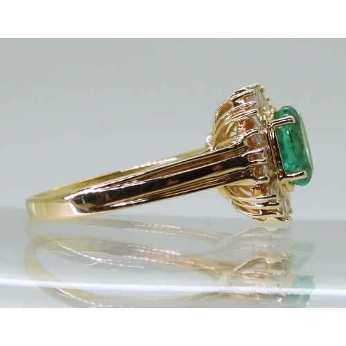 2770 - AN 18CT EMERALD & DIAMOND RINGset with an oval cut emerald of 7mm x 5.6mm, with brilliant and ba... 