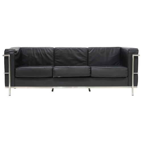 2099 - A 20TH CENTURY AFTER LE CORBUSIER THREE SEATER SETTEE with black vinyl cushions on chromed tubu... 