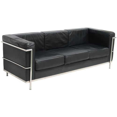 2099 - A 20TH CENTURY AFTER LE CORBUSIER THREE SEATER SETTEE with black vinyl cushions on chromed tubu... 