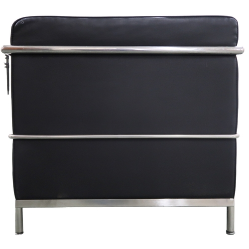 2099 - A 20TH CENTURY AFTER LE CORBUSIER THREE SEATER SETTEE with black vinyl cushions on chromed tubu... 