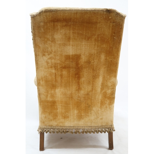 2016 - AN EARLY 20TH CENTURY GEORGIAN STYLE WINGBACK ARMCHAIR with Damask upholstery on carved lions p... 