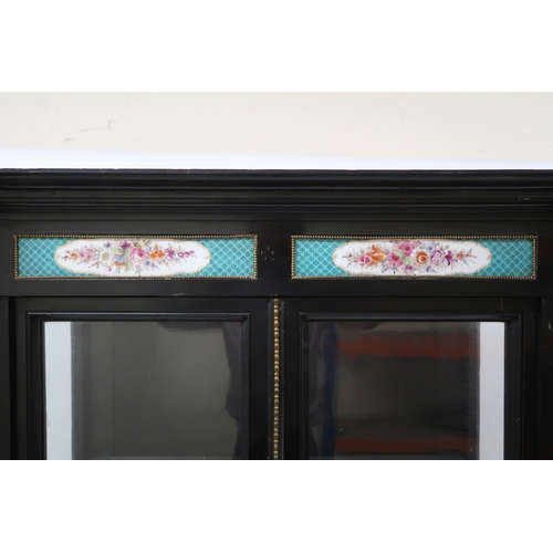 2022 - A 19TH CENTURY FRENCH EBONISED DISPLAY CABINET with moulded cornice with Sevres style plaques over p... 