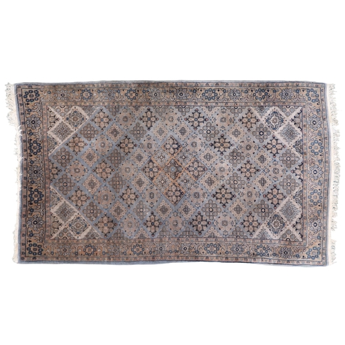 2136 - A GREEN GROUND QASHQAI RUG with all over geometric lozenge patterned ground within geometric fl... 