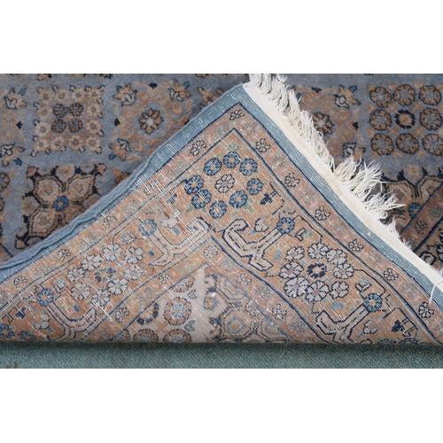 2136 - A GREEN GROUND QASHQAI RUG with all over geometric lozenge patterned ground within geometric fl... 