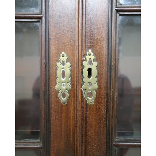 2034 - A 19TH CENTURY MAHOGANY BREAKFRONT BOOKCASE with moulded cornice over four astragal glazed doors on ... 