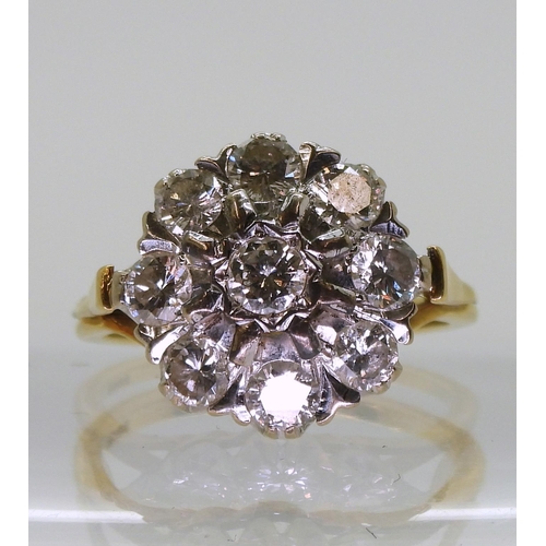 776 - An 18ct gold and diamond cluster ring set with estimated approx 1.35cts of brilliant cut diamonds, f... 