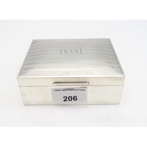 206 - A Goerge V silver cigarette box, by William Hair Haseler, Birmingham 1933, the lid with engine-turne... 