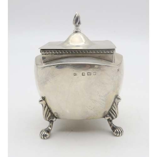 208 - An Edwardian silver tea caddy, by William Devenport, Birmingham 1905, of shaped square form, on four... 