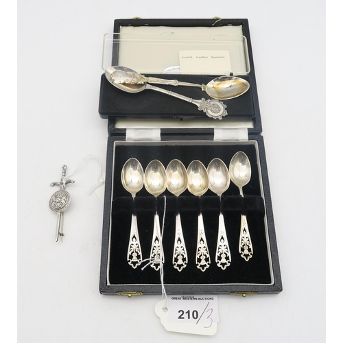 210 - A silver sword and shield brooch, by Robert Allison, and a cased set of Scottish silver coffee spoon... 