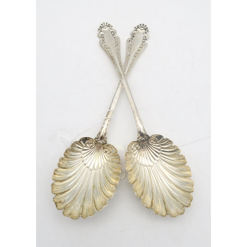 216 - A pair of late-Victorian silver serving spoons, by James Deakin & Sons, Sheffield 1899, with eng... 