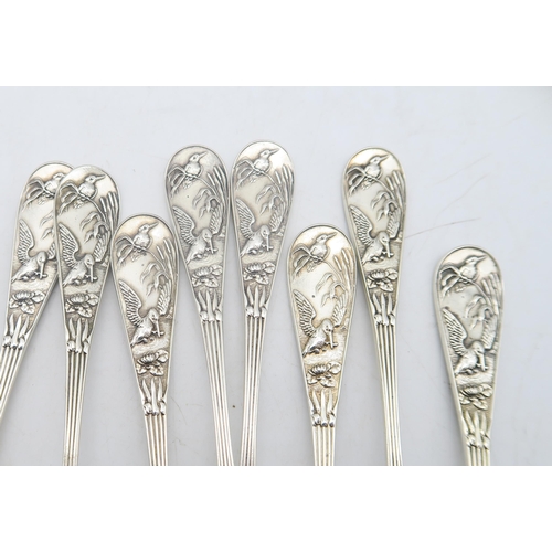 217 - A set of ten Victorian silver tea spoons, by George Adam, London 1881, decorated in the aesthetic st... 