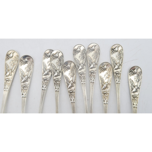 217 - A set of ten Victorian silver tea spoons, by George Adam, London 1881, decorated in the aesthetic st... 