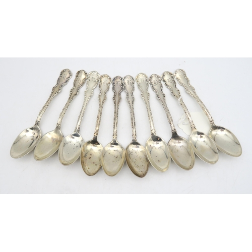 221 - A set of Canadian silver teaspoons, by P.W Ellis & Co, with scrollwork borders, 312gms  (10)