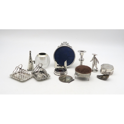 226 - A collection of silver including a silver glass globular match striker, Birmingham, a pair of silver... 