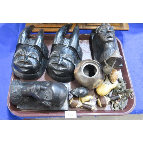 131 - A pair of African masks, metal figures etc