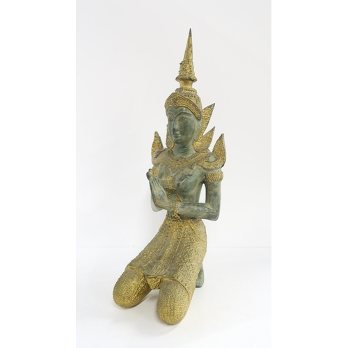 132 - A Thai gilt bronze kneeling deity