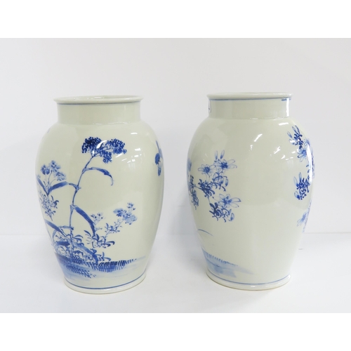 134 - A pair of Chinese blue and white vases, one depicting a kingfisher