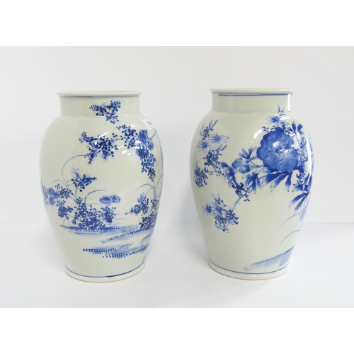 134 - A pair of Chinese blue and white vases, one depicting a kingfisher