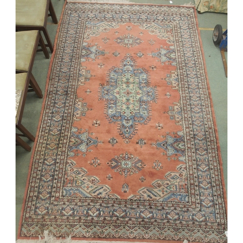 70 - A lot comprising terracotta ground Persian style rug with multicoloured central medallion, matching ... 