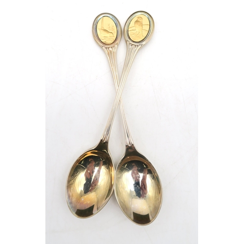 229A - A John Pinches cased silver set; The Royal Society for The Protection of Birds Spoon Collection, twe... 