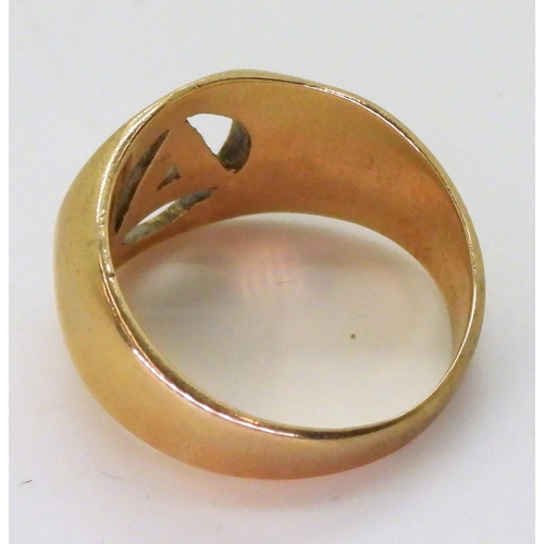 763 - A 9ct gold Masonic (?) symbol ring, size X1/2, weight 10.7gms