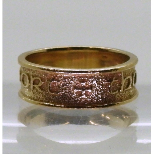 774 - A 9ct gold ring with embossed Celtic phrase 'Tha gaol agam ort' - I Love you, made by Ola Gorie, sta... 