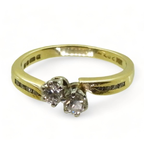 775 - An 18ct gold twin stone diamond ring, set with estimated approx 0.30cts of brilliant cut diamonds, w... 