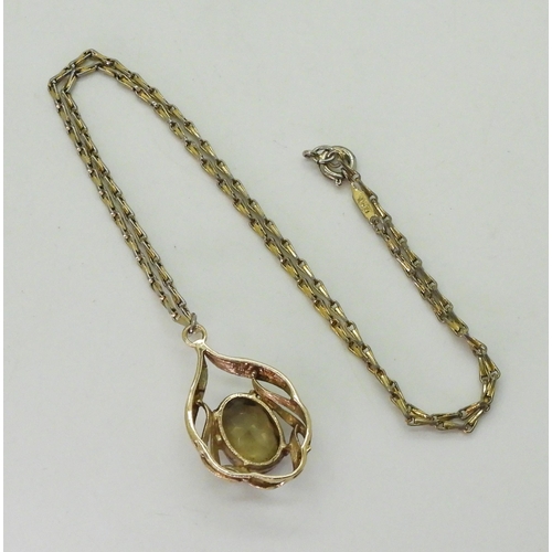 781 - A 9ct gold smoky quartz pendant with a gold plated Monet chain, weight of the pendant approx 3.8gms