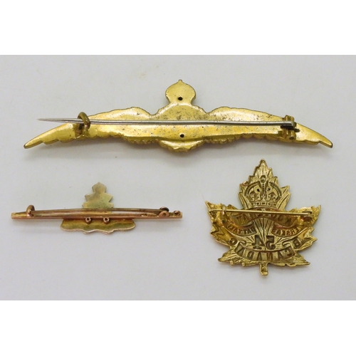 783 - A 9ct gold Royal Artillery sweetheart brooch, weight 3.6gms together with two gold plated sweetheart... 