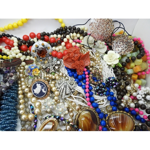 830 - A large collection of costume jewellery to include a string of Cherry amber coloured beads, (weight ... 