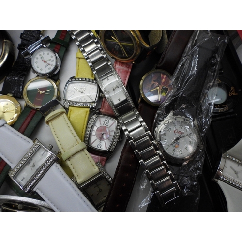 845 - A large collection of ladies fashion watches, to include, a mother of pearl dial Skagen watch, a Lor... 