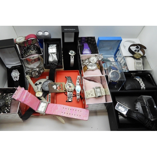 846 - A large collection of ladies fashion watches, to include, a Danbury Mint Titanic Centenary silver in... 