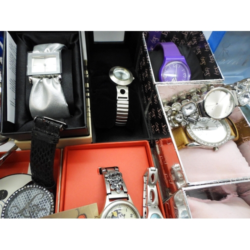 846 - A large collection of ladies fashion watches, to include, a Danbury Mint Titanic Centenary silver in... 