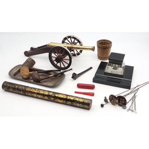 526 - An eclectic mixed lot, to include a desk canon with well-cast brass barrel, black glass desk inkwell... 