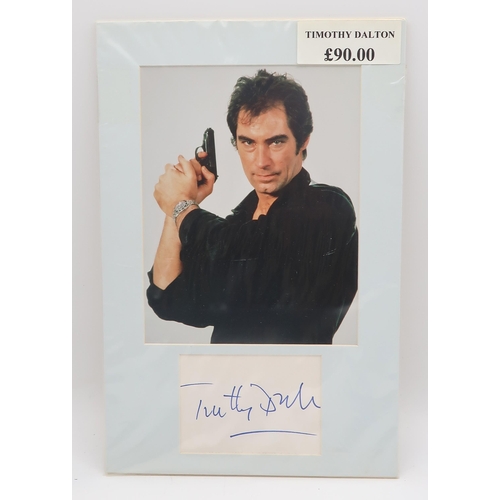 564 - JAMES BONDA collection of signed photographs of James Bond actors and associated figures, to include... 