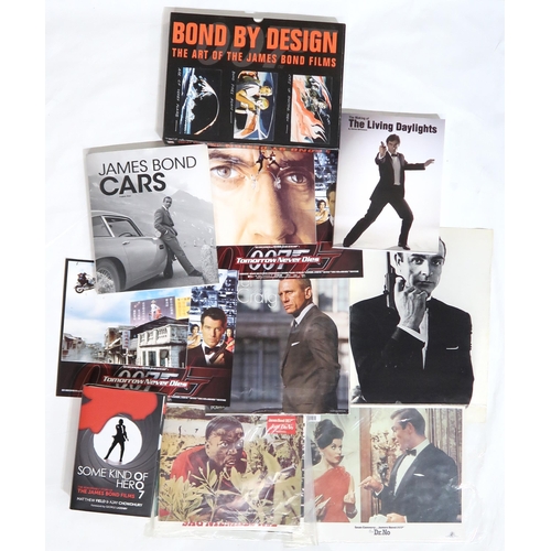 570 - JAMES BONDA collection of prints, books and magazines on Bond, to include two circular carboard spin... 