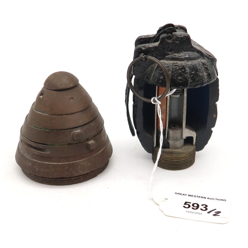 593 - A bisected Mills bomb/hand grenade, together with a WW1-period no. 85 artillery fuse head (2)