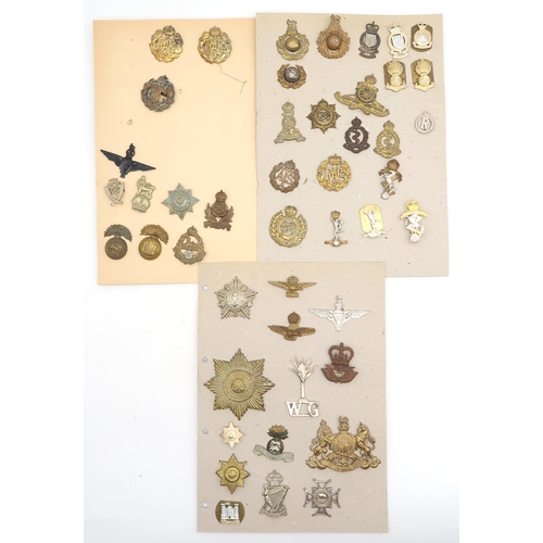 594 - An album of mixed military cap badges, to include the RAF/RFC, Intelligence Corps, East Lancashire R... 