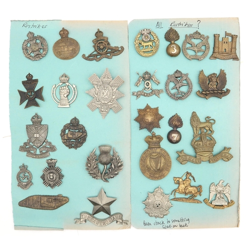 594 - An album of mixed military cap badges, to include the RAF/RFC, Intelligence Corps, East Lancashire R... 