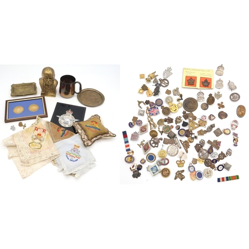 598 - A large and varied assortment of militaria, to include WW1-period Canadian Expeditionary Forces badg... 